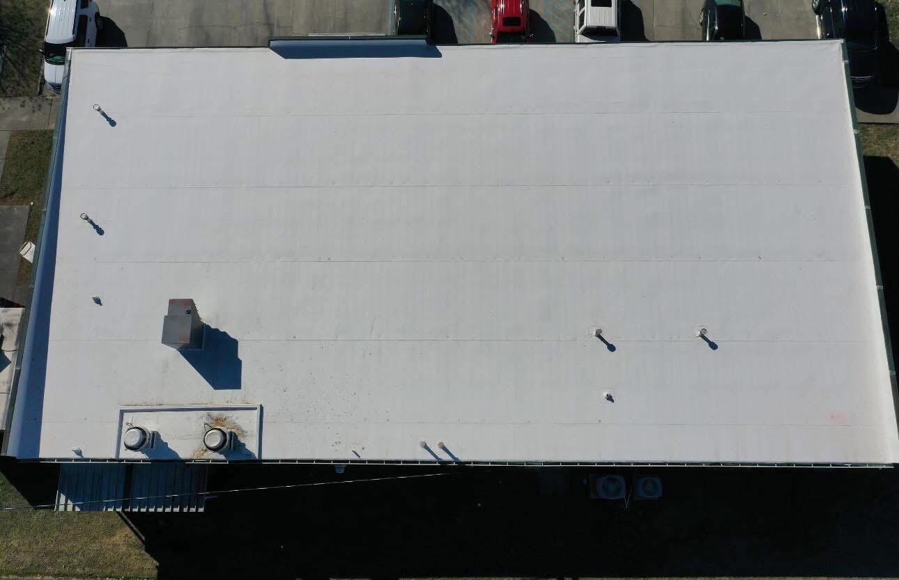 Overhead view of a completed flat commercial roof